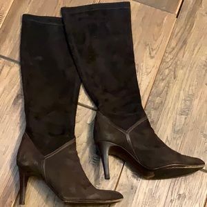 Cole Haan brown heeled boots.